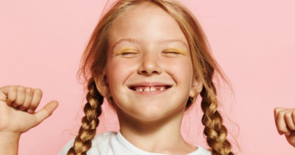 confident young girl smiling showing self confidence in inclusive youth empowerment program